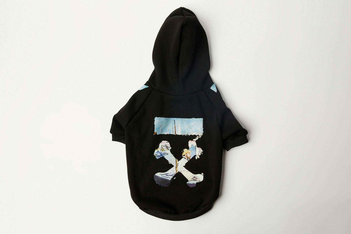 Black dog hoodie featuring a scenic graphic print with ocean and people details on back