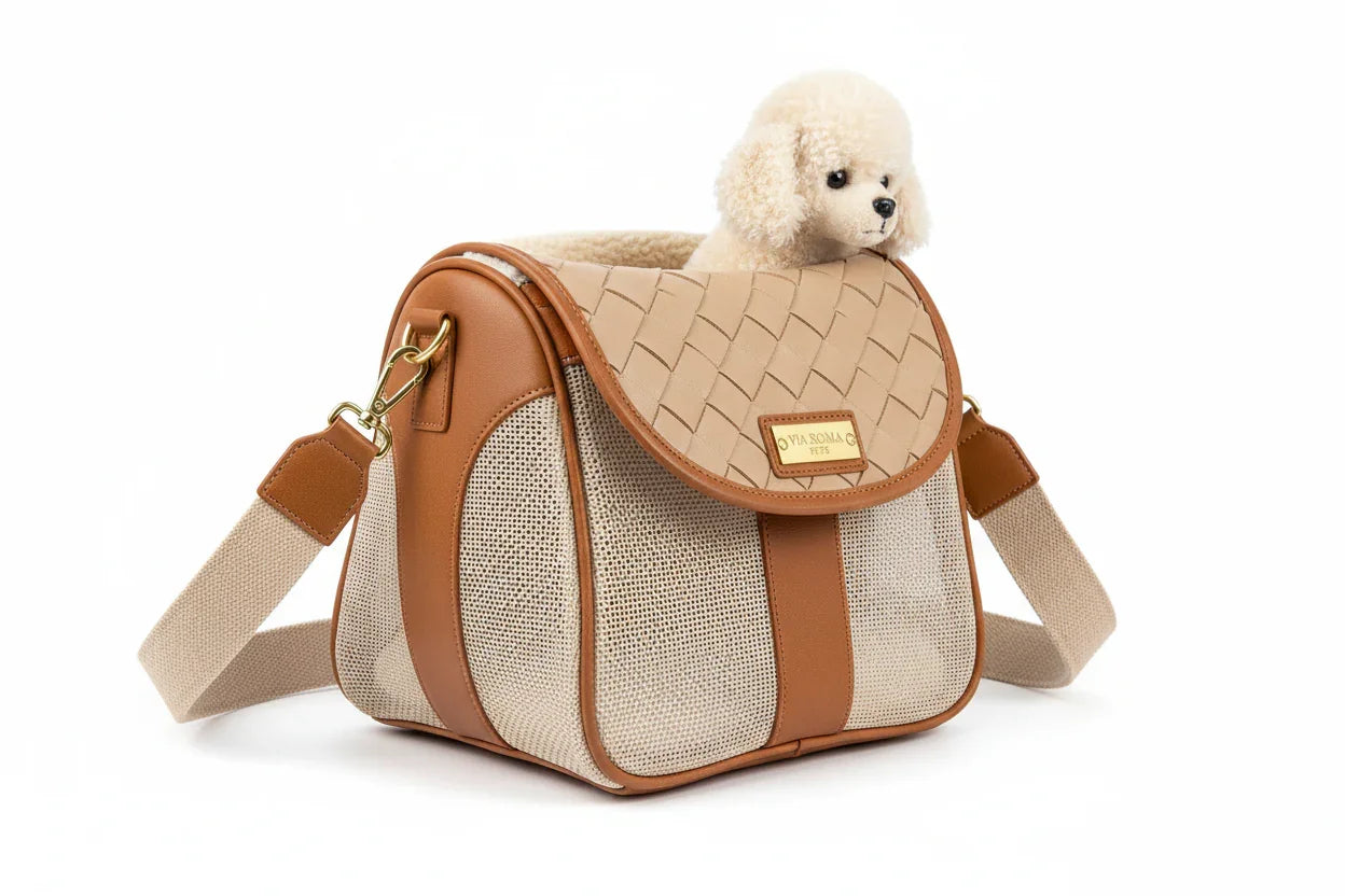 Tan and beige shoulder pet carrier bag with a small plush dog peeking out