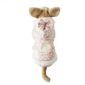Small dog wearing pink polka dot hooded coat with bow and white fleece trim, back view