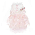 Elegant pink floral baby dress with tulle skirt and delicate bow details on white background