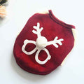 Red festive pet sweater with white reindeer antlers and pom-pom nose design