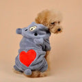 Small brown poodle wearing gray plush dog hoodie with bear face and red heart on back