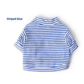 Striped blue and white short sleeve turtleneck shirt laid flat on white background