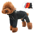 Fluffy brown dog wearing black waterproof raincoat coveralls with elastic cuffs and reflective stripes