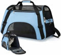 Light blue soft-sided pet carrier with black mesh panels and black handles, featuring a small cat inside