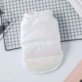 White disposable pet diaper on black grid surface, lightweight and padded