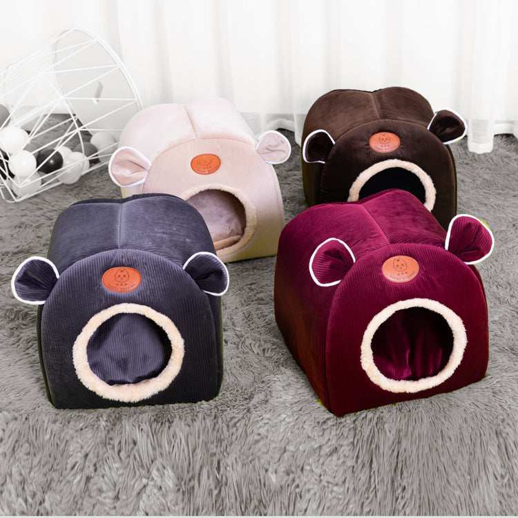 Casetta rettangolare per cuccioli "Happy Puppies" con orecchie decorative e ingresso tondo. Realizzata in velluto artico e corduroy per massimo comfort.