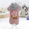 Gray plush dog mannequin wearing pink corduroy pet dress with flower and love embroidery
