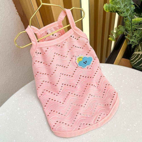 Pink breathable dog tank top with wavy cut-out pattern and cute cloud patch on gold hanger