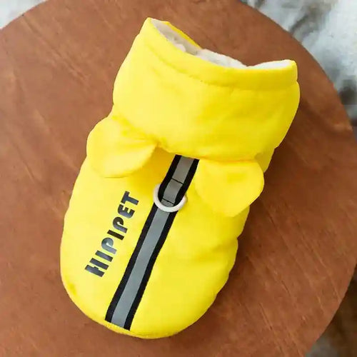 Yellow Hipipet dog and cat jacket with hood, reflective stripe, ear details, and leash ring on wooden surface