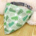 Green dog bandana with cartoon crocodile, clouds, and rainbows on nylon collar background