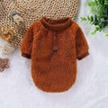 Brown fluffy fleece dog sweater with ribbed collar and sleeve cuffs, displayed on white surface