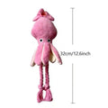 Pink plush squid dog toy with rope legs and whistle, 32cm long on white background